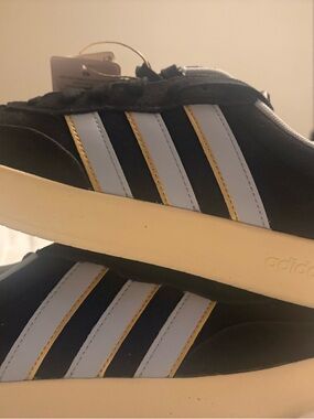 Adidas Black Sneakers with White Stripes and Gold Trim 8 Women’s, 6.5 Mens